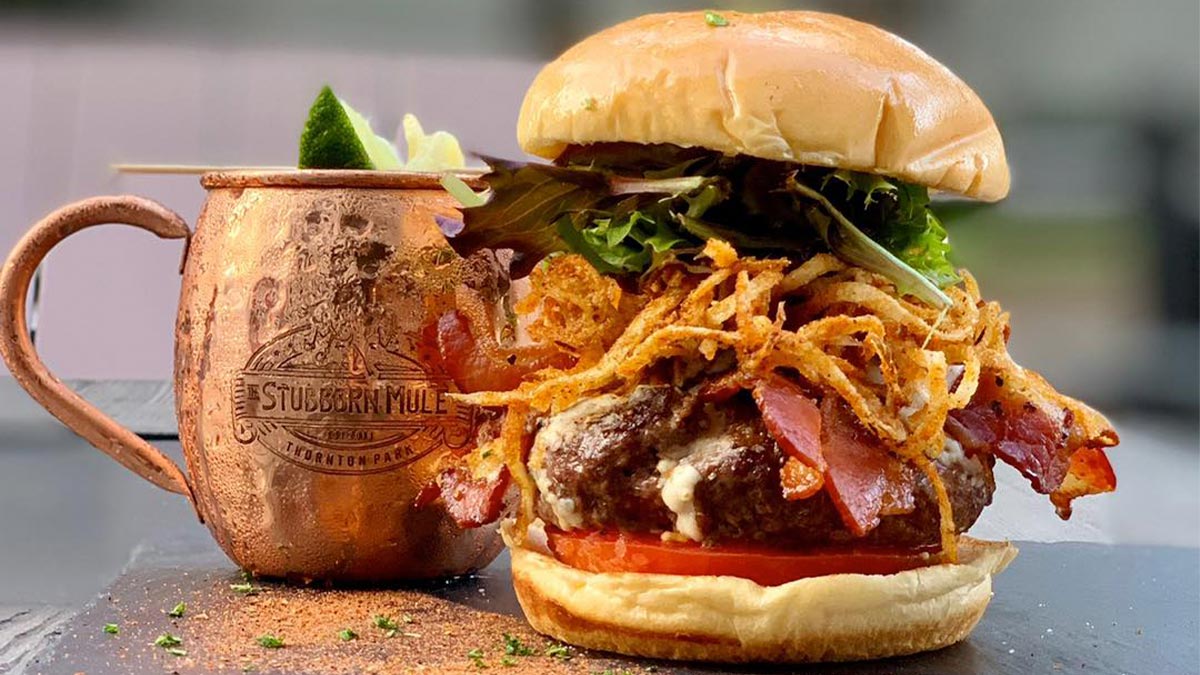 close up of cold drink and burger at The Stubborn Mule in Orlando, Florida, USA